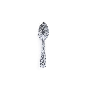 The Splatter Enamelware Medium Spoon, featuring a classic black and white speckled design and crafted in timeless enamelware style, is centered on a plain white background—ideal for serving or entertaining guests.