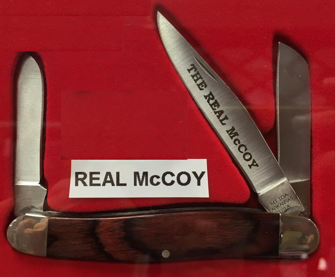 A knife with rosewood handle and blades in a red box, the Real McCoy.