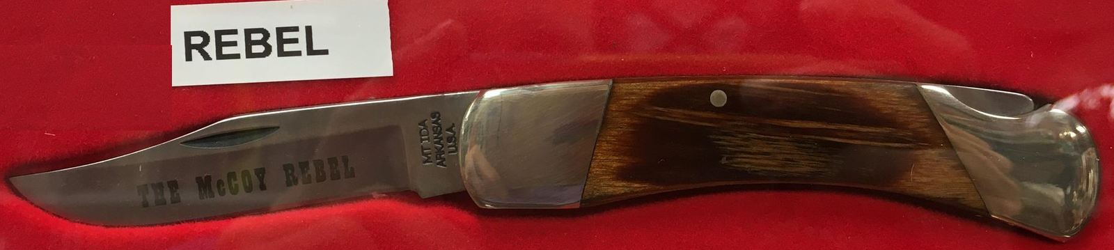 A lock back knife with an Oak handle and McCoy Rebel blade.