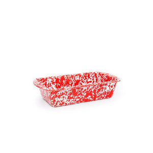 Splatter Enamelware Loaf Pan featuring a red and white speckled rectangular design with handles, crafted with a durable porcelain finish and shown on a white background. This oven-safe loaf pan combines style and functionality for all your baking needs.