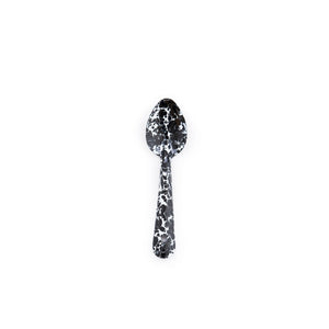 The Splatter Enamelware Small Spoon, featuring a black and white marbled design, is centered on a plain white background—an elegant choice for serving guests while entertaining.