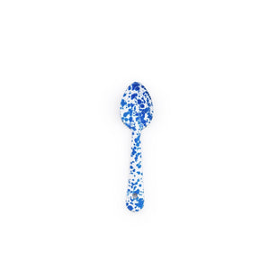 Introducing the Splatter Enamelware Small Spoon—a metal spoon featuring a crisp white base with a striking blue splatter pattern. Photographed on a plain white background, this charming serveware piece is perfect for adding a pop of color to your entertaining collection.
