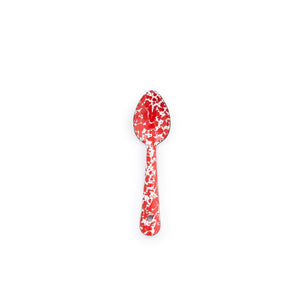 Centered on a white background, the Splatter Enamelware Small Spoon features a red and white speckled pattern—an ideal way to introduce colorful, classic enamelware serveware to your entertaining essentials.