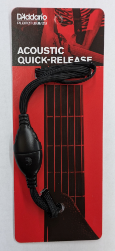 The D'Addario Quick Release, shown on red and black packaging with a close-up of a guitar neck and strap, offers convenient attachment for musicians.