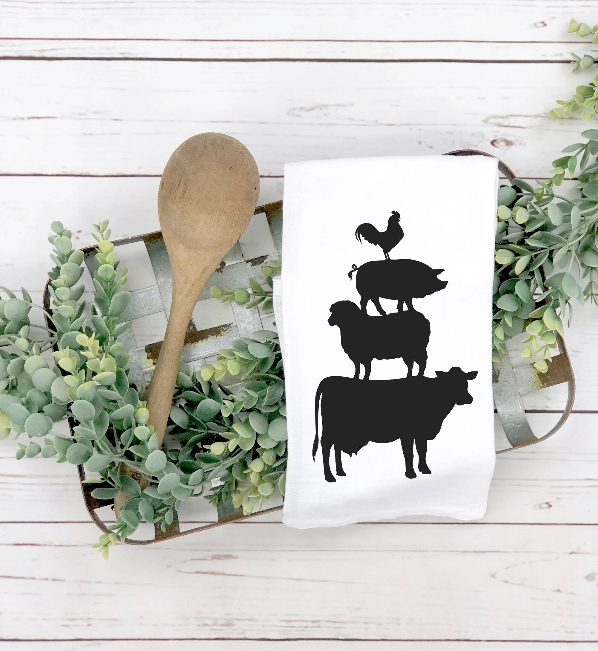 The Animal Stack Tea Towel, with silhouettes of cows and chickens, is perfect for a farmhouse-style kitchen.