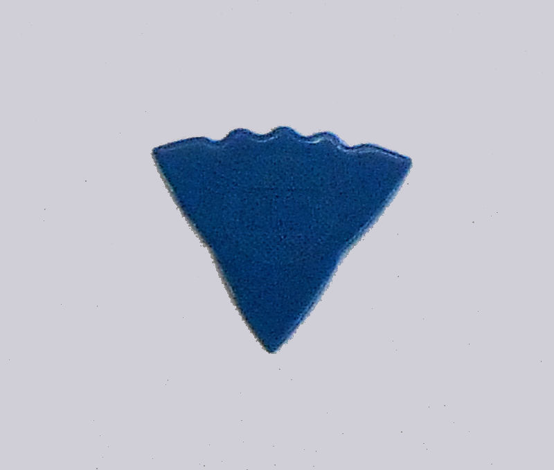 A textured blue triangle on a white surface, perfect for dulcimer players who prefer Herdim Picks - Blue.