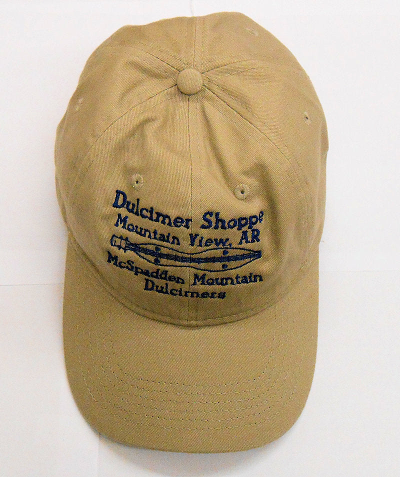 A Dulcimer Shoppe Cap - Tan with a blue logo on it.
