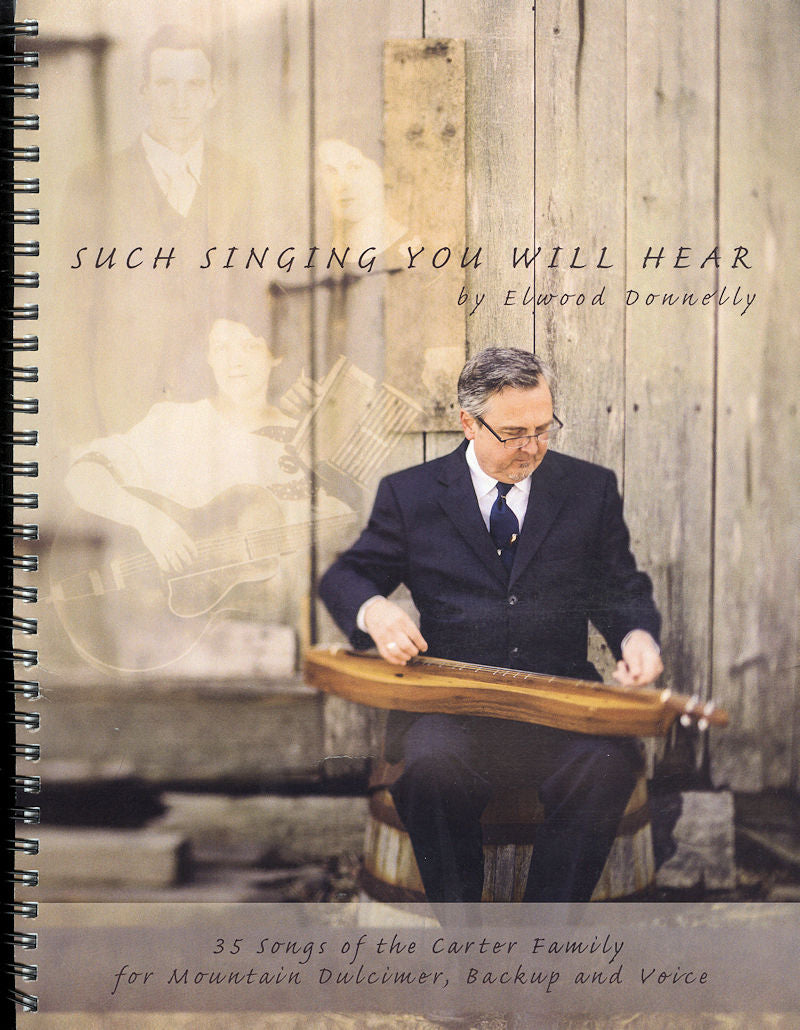 A man in a suit plays a mountain dulcimer in front of a rustic wooden backdrop. The book title "Such Singing You Will Hear - by Elwood Donnelly," featuring 35 songs of the Carter Family and their original recordings, overlays the image.