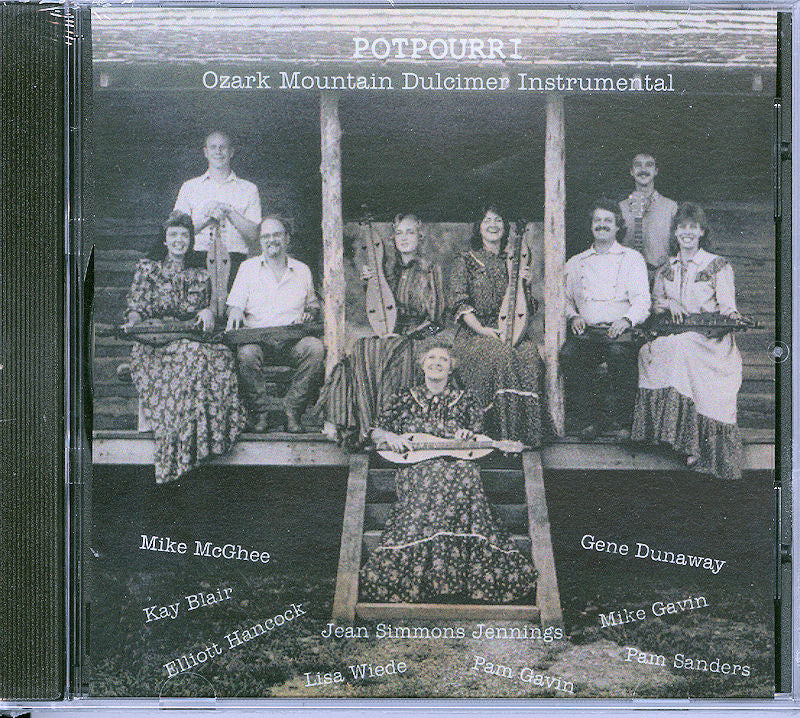 CD cover featuring a group of eight people sitting and standing on wooden steps, titled "Potpourri by Dancing Doll: Ozark Mountain Dulcimer Instrumental," with the names of the group members listed.