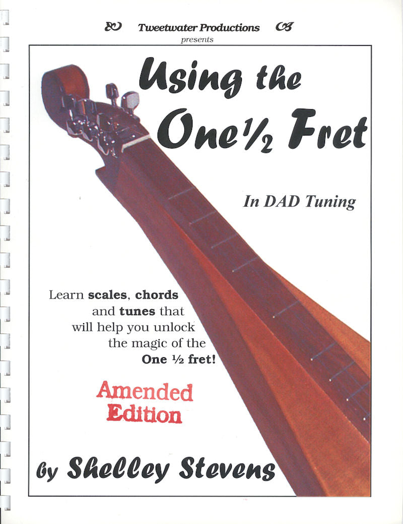 Cover of the music book "Using the One 1/2 Fret by Shelley Stevens" showcasing a dulcimer image. This "Amended Edition" explores scales and chords in DAD tuning, promising an enriched musical journey.