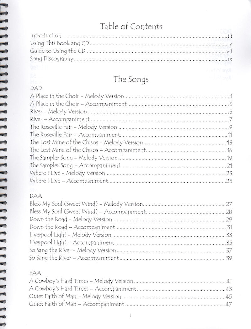 A spiral bound notebook with text containing melody and chord tablature by So Sang the River - by Heidi Muller.