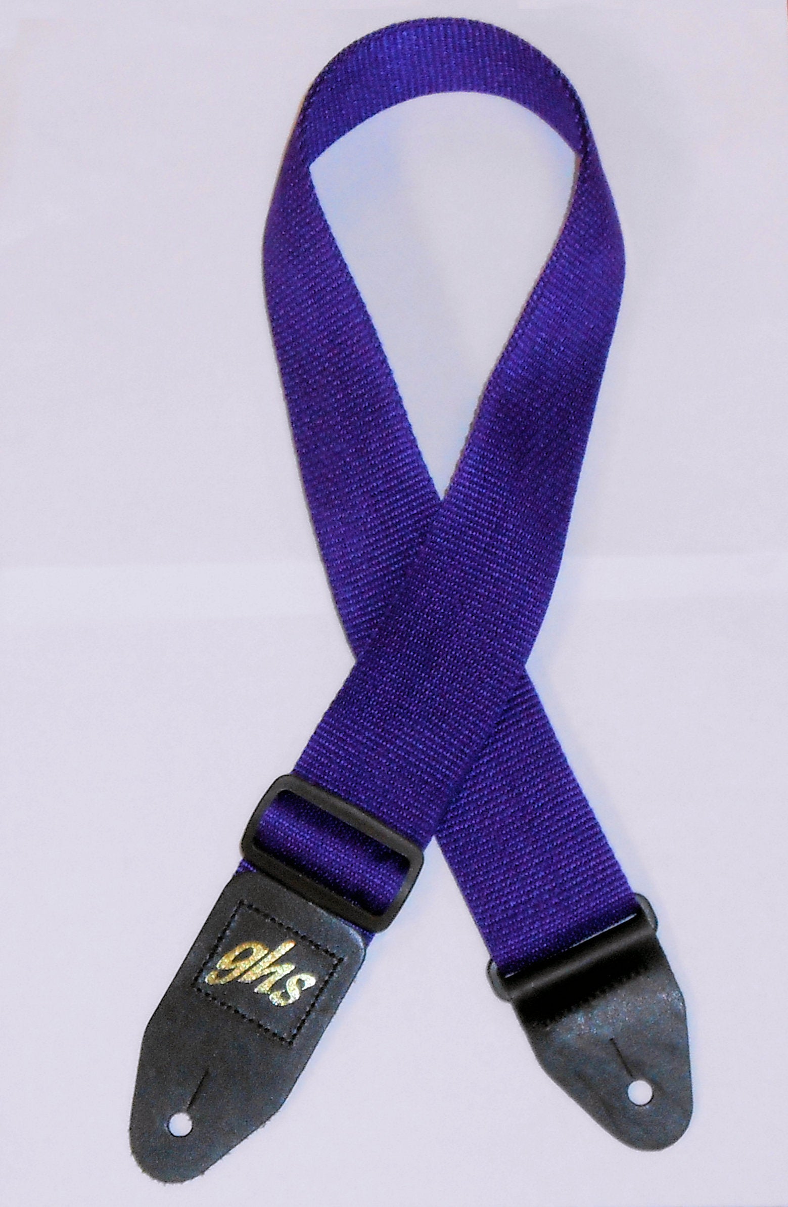 A Nylon Strap - Purple with a black buckle.