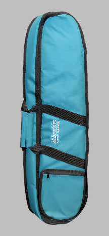 The Ginger Case is a blue and black padded trumpet gig bag that stands upright against a wooden wall. It features backpack straps for easy carrying, a small front pocket, and a side handle, ensuring foam padding keeps your instrument safe.