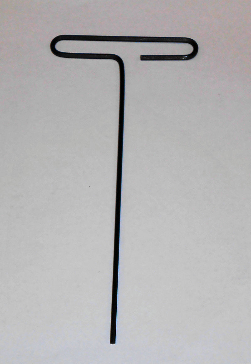 A black metal rod with a letter t and Autoharp Fine Tuning Wrench on it.