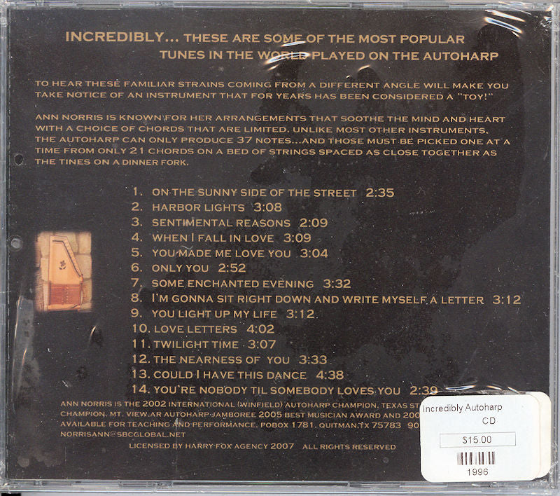 Back cover of an Incredibly Autoharp case displaying a tracklist of 12 songs, barcode, label logos, and a $15.00 price sticker, dated 1996 and designed by Ann Norris.