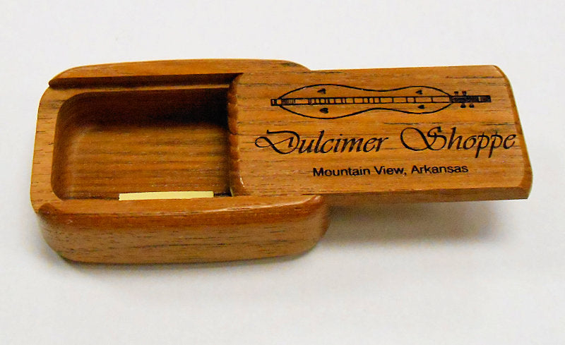 A Dulcimer Shoppe Secret Box Large with a wooden ukulele in it.