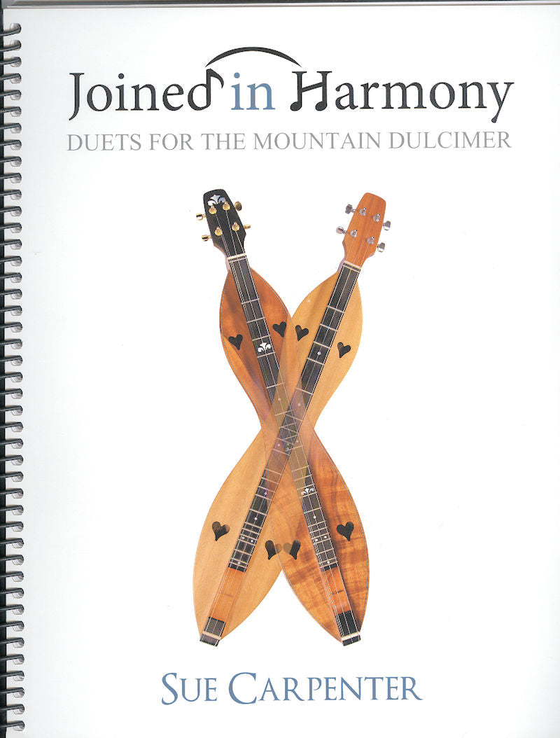 Cover of the book "Joined in Harmony by Sue Carpenter," featuring an image of two intertwined mountain dulcimers. The book includes duet arrangements and comes with a practice CD.