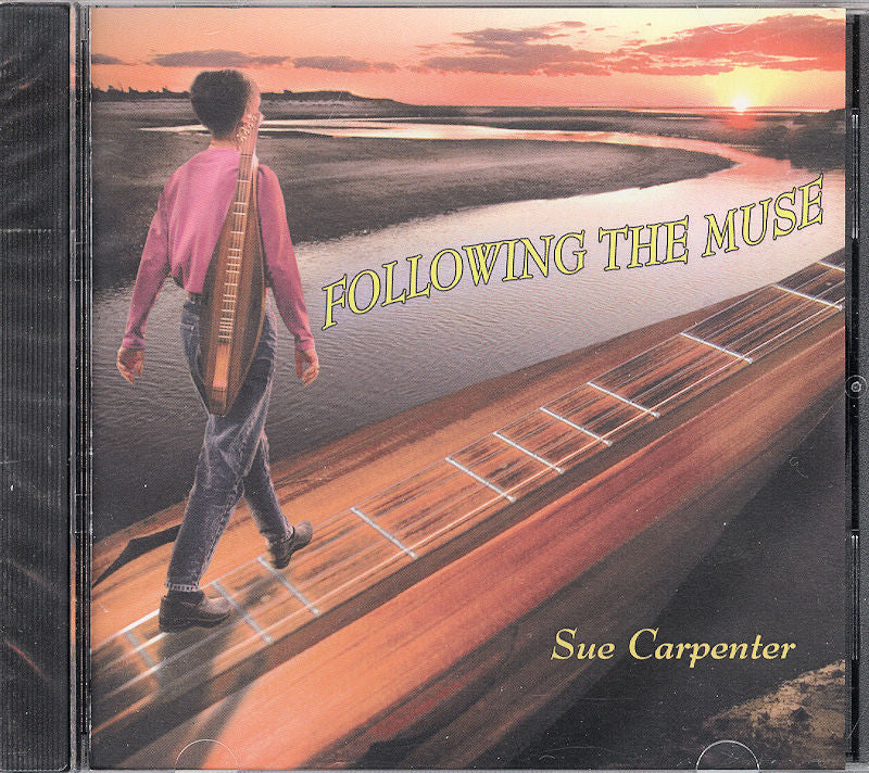 Album cover depicting a person walking on an enormous mountain dulcimer beside a sunset river. The text reads "Following the Muse by Sue Carpenter," capturing the essence of instrumental harmony.