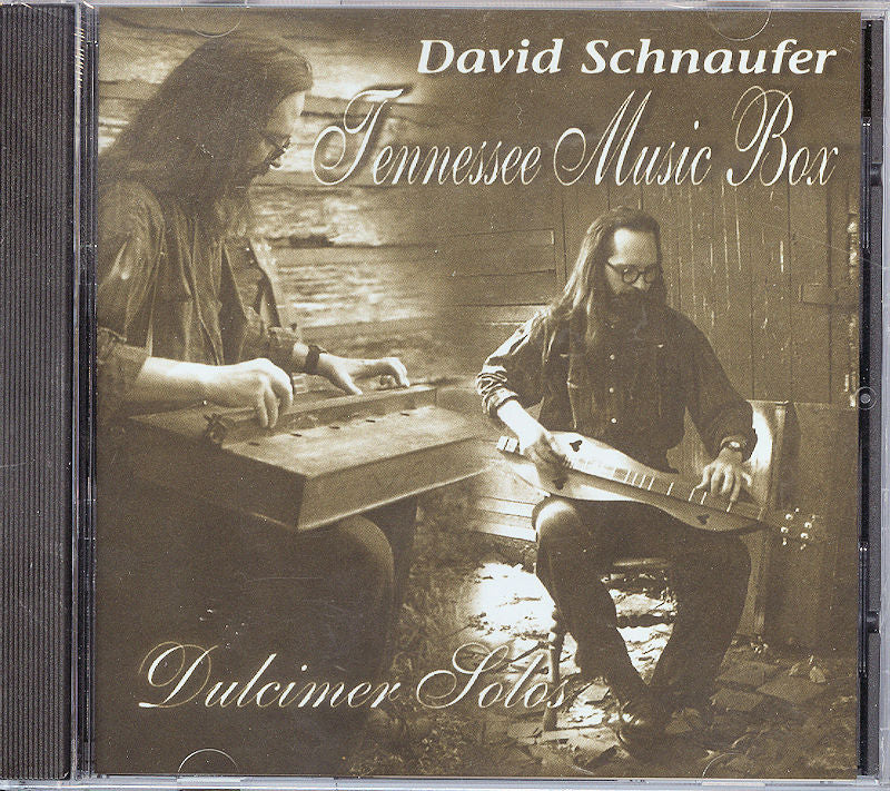 Sepia-toned album cover featuring a musician playing a dulcimer, highlighting its distinctive sound. Text reads "Tennessee Music Box by David Schnaufer, Dulcimer Solos.