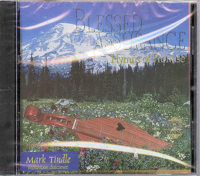 CD cover featuring a mountain dulcimer in a wildflower meadow with a snow-capped mountain and forest in the background. Text: "Blessed Assurance" by Mark Tindle.