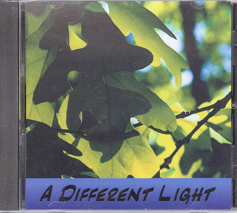 CD cover featuring a close-up of green leaves illuminated by sunlight, displaying the text "A Different Light by Jonathan Dowell" at the bottom.