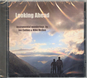 CD cover for "Looking Ahead" by Joe Collins. It features a sunset or sunrise over a mountainous landscape with two people silhouetted in the foreground, capturing the essence of their instrumental wanderings.