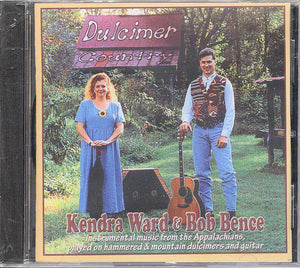 A Dulcimer Country CD - by Kendra Ward and Bob Bence, featuring them in front of a tree.
