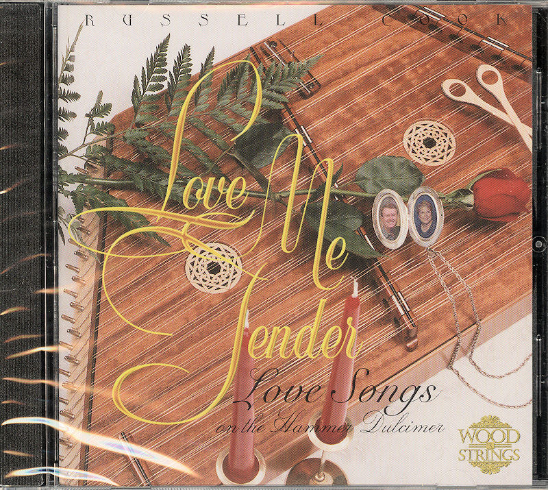CD cover for "Love Me Tender" by Russell Cook, featuring a wooden background with plants, a spool of thread, and a photo cameo.