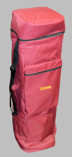 A Double Dulcimer Case sitting on a brick floor.