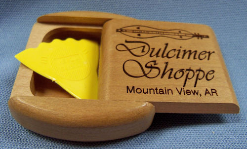 A Dulcimer Shoppe Secret Box - Small with a pick in it.
