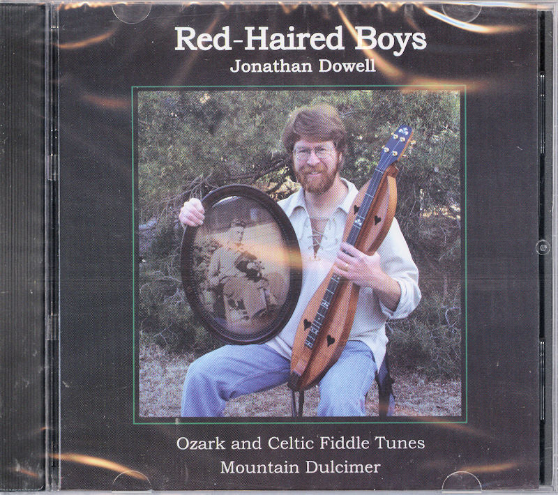 CD cover for "Red-Haired Boys" by Jonathan Dowell, showing him with a mountain dulcimer and a framed photo. The text includes "Ozark and Celtic Fiddle Tunes" and "Mountain Dulcimer.