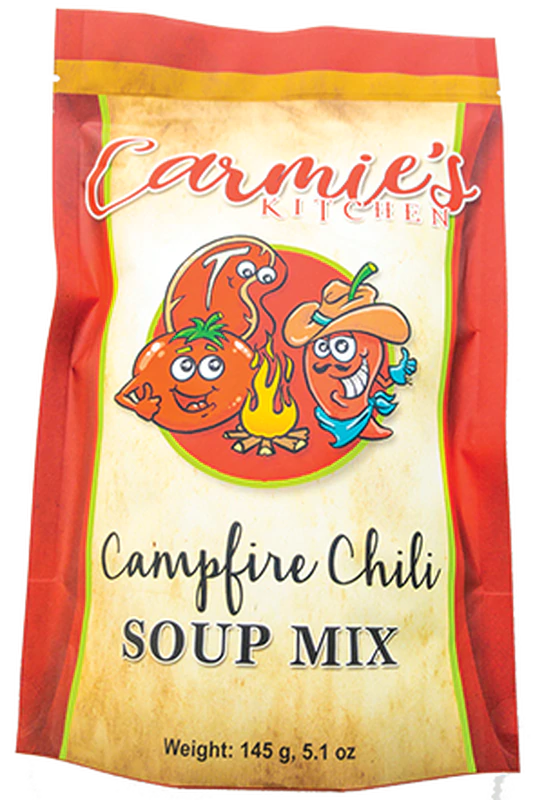 The 145g Campfire Chili Soup Mix packaging features playful cartoon graphics of a chili pepper, tomato, and flames. As part of Carmie's all-natural range, it's ideal for those seeking a wholesome and hearty meal.
