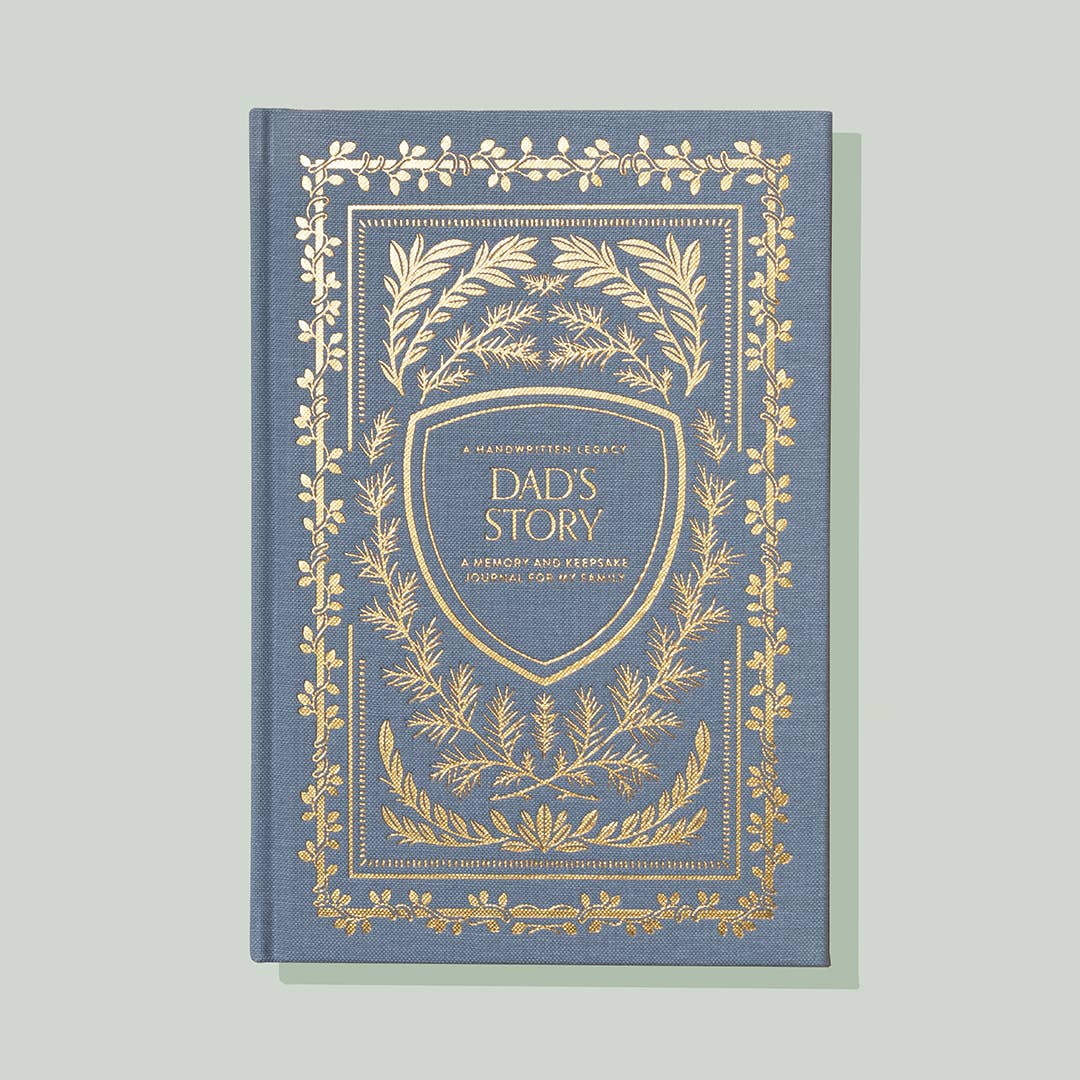 A Dad's Story memory book with gold foil on it.