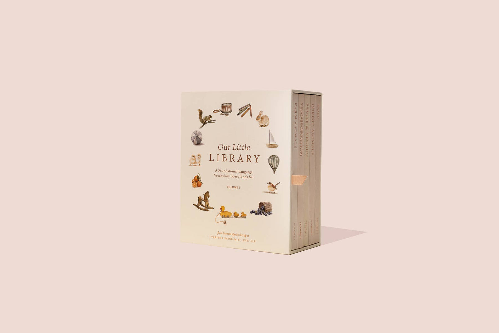 Our Little Library, a board book with a picture of a cat on a pink background, perfect for introducing first words and building vocabulary.