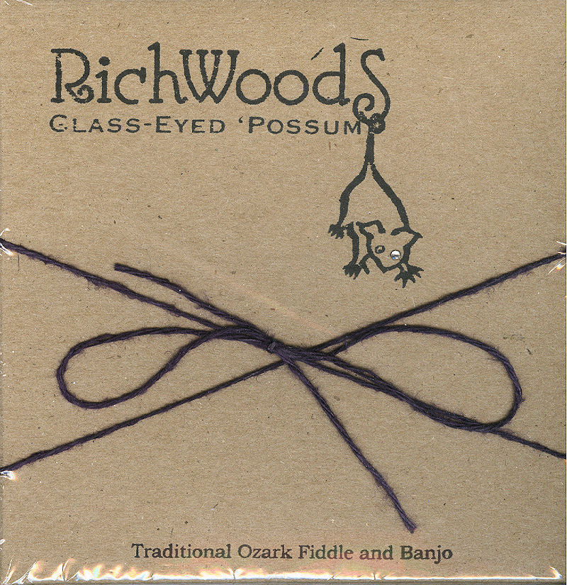 Cover of "RichWoods Glass-Eyed 'Possum" by Emily Phillips and Martin Darrell, showcasing a cartoon possum hanging upside down. The cover includes the text: "Traditional Ozark Fiddle and Banjo," with a purple string tied in a bow.